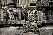 Prambanan - Candi Lara Jonggrang, miniature shrines surmounted by small fluted stupa with panels with musicians and dancers decorating the top of the balustrade 